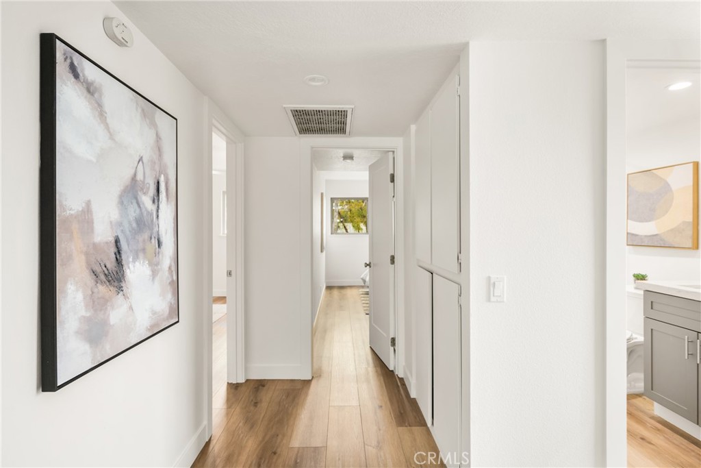 1538 Windsor Lane Fullerton, CA 92831 - Photo 28 of 40 a view of a hallway with wooden floor and closet