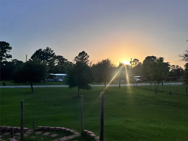 a backyard of a house with lots of green space