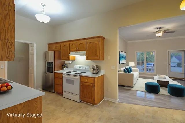 a kitchen with a sink stove and cabinets