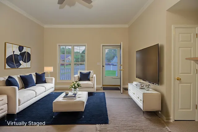 a living room with furniture and a fireplace
