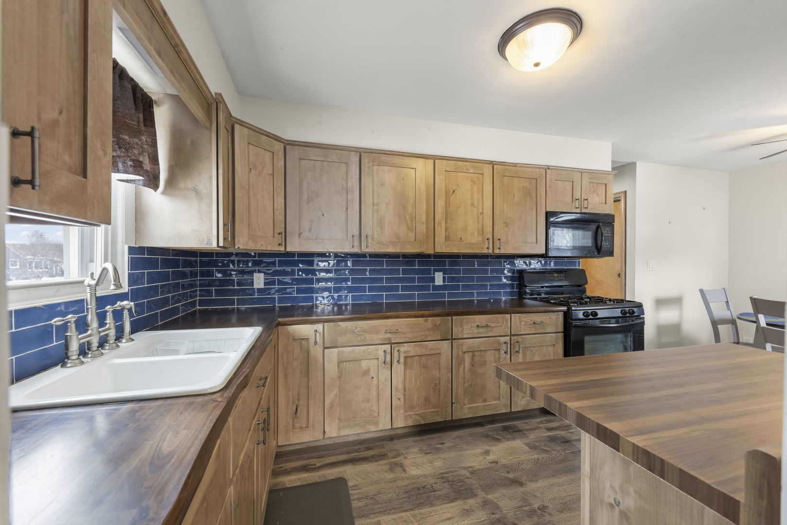 2145 Root Street Crest Hill, IL 60403 - Photo 8 of 34 a kitchen with stainless steel appliances granite countertop a sink stove and refrigerator