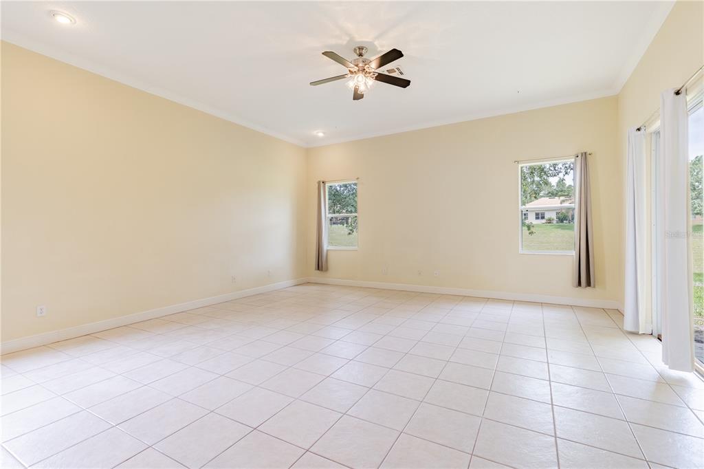 2718 Knightsbridge Road Clermont, FL 34711 - Photo 24 of 72 wooden floor in an empty room with a window