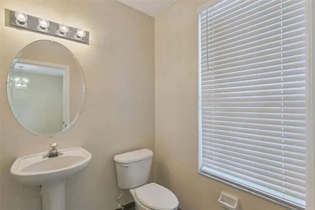 an aerial view of residential houses with outdoor space and garden