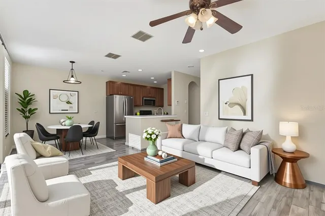 an aerial view of residential houses with outdoor space and swimming pool