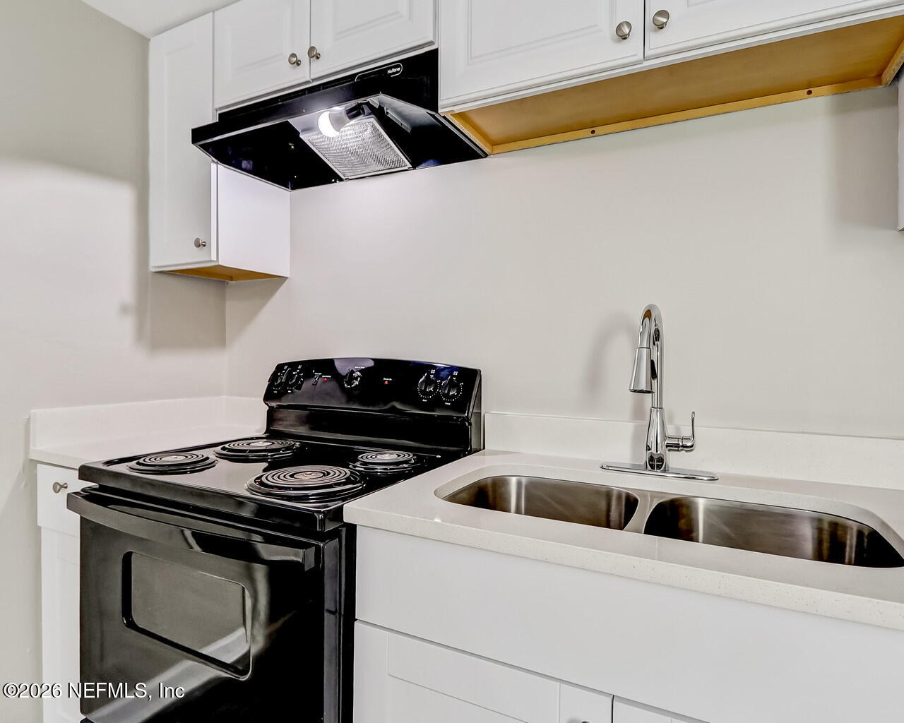 2140 Jayson Avenue Jacksonville, FL 32208 - Photo 13 of 34 a kitchen with stainless steel appliances a sink a stove and cabinets