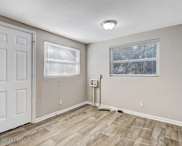 a view of an empty room with a window