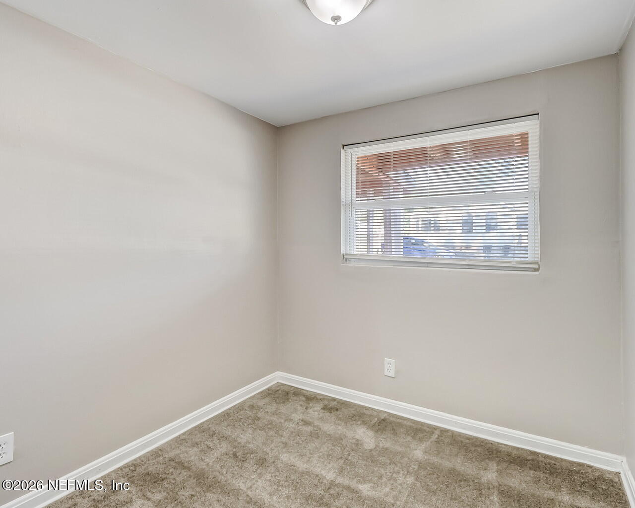 2140 Jayson Avenue Jacksonville, FL 32208 - Photo 18 of 34 a view of an empty room with a window