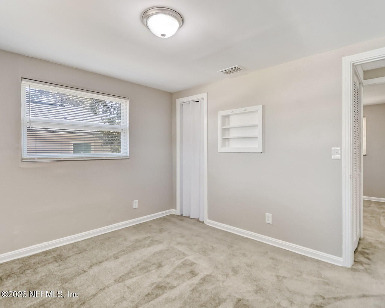 2140 Jayson Avenue Jacksonville, FL 32208 - Photo 21 of 34 an empty room with a window