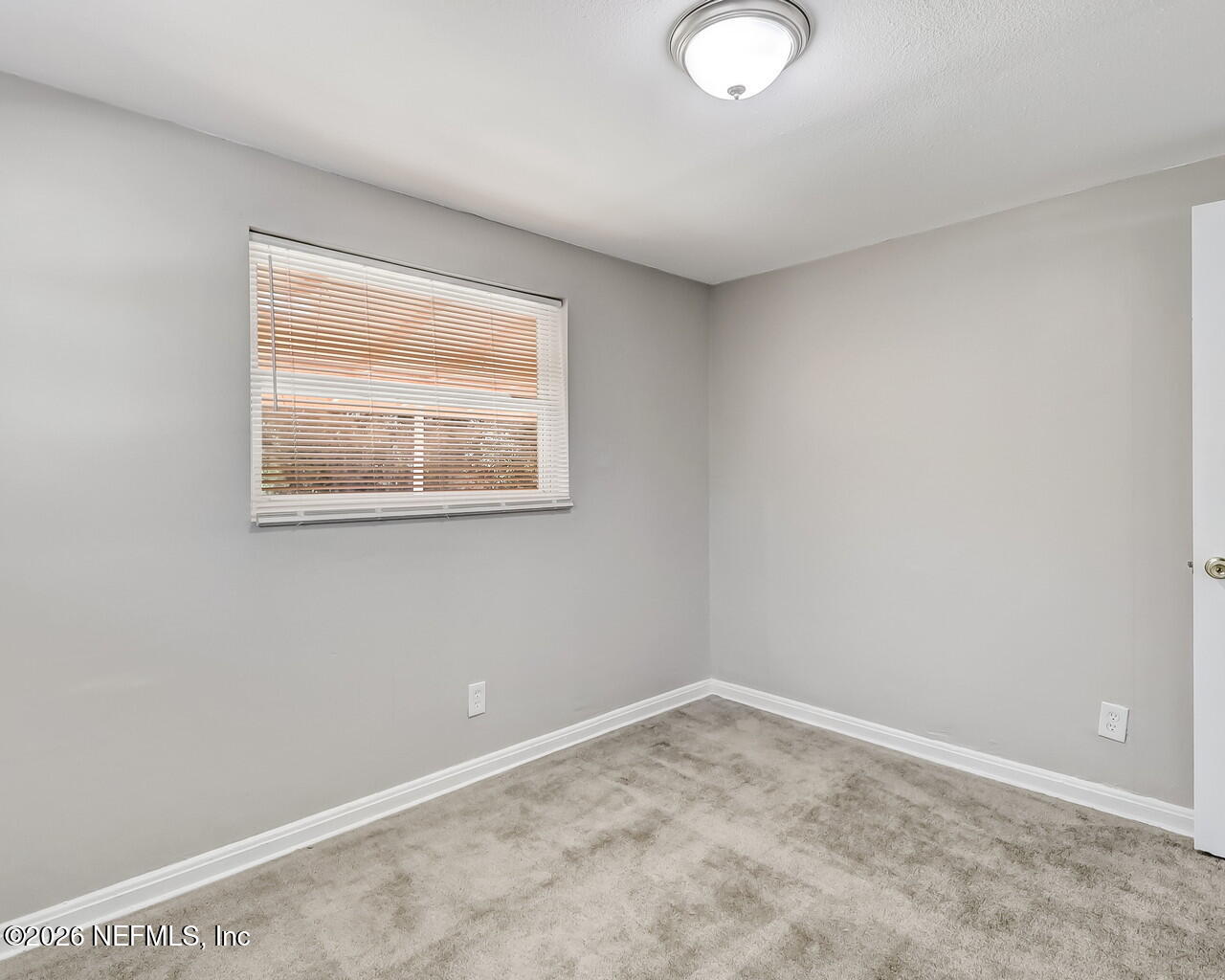 2140 Jayson Avenue Jacksonville, FL 32208 - Photo 26 of 34 an empty room with a window