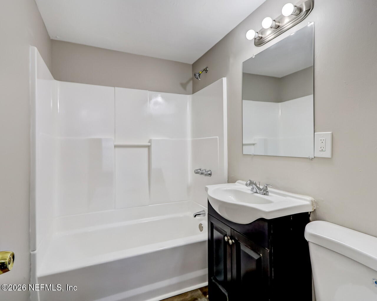 2140 Jayson Avenue Jacksonville, FL 32208 - Photo 27 of 34 a bathroom with a sink a toilet and shower