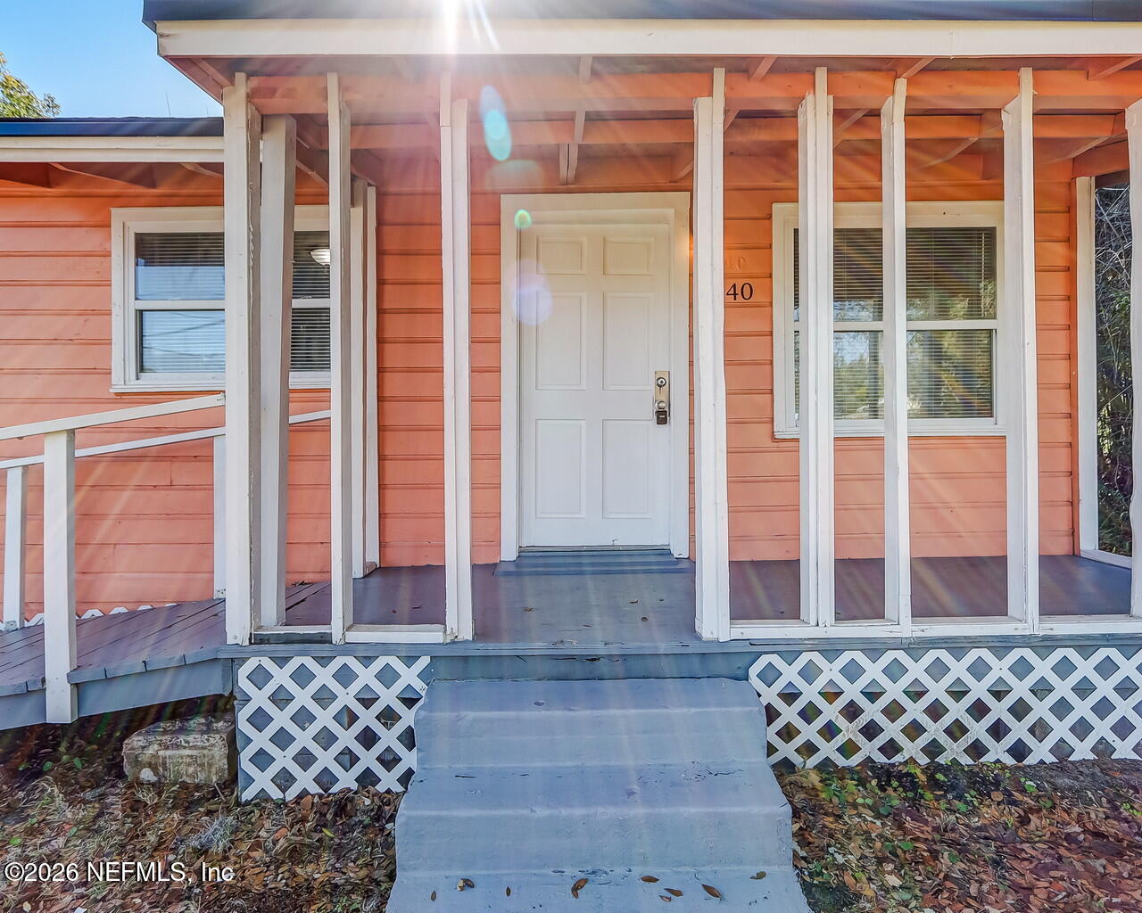 2140 Jayson Avenue Jacksonville, FL 32208 - Photo 4 of 34 a view of a brick house with large windows
