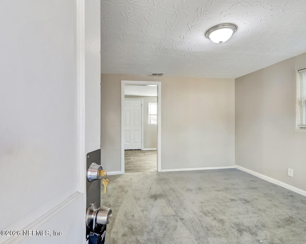 2140 Jayson Avenue Jacksonville, FL 32208 - Photo 5 of 34 an empty room with a bathroom