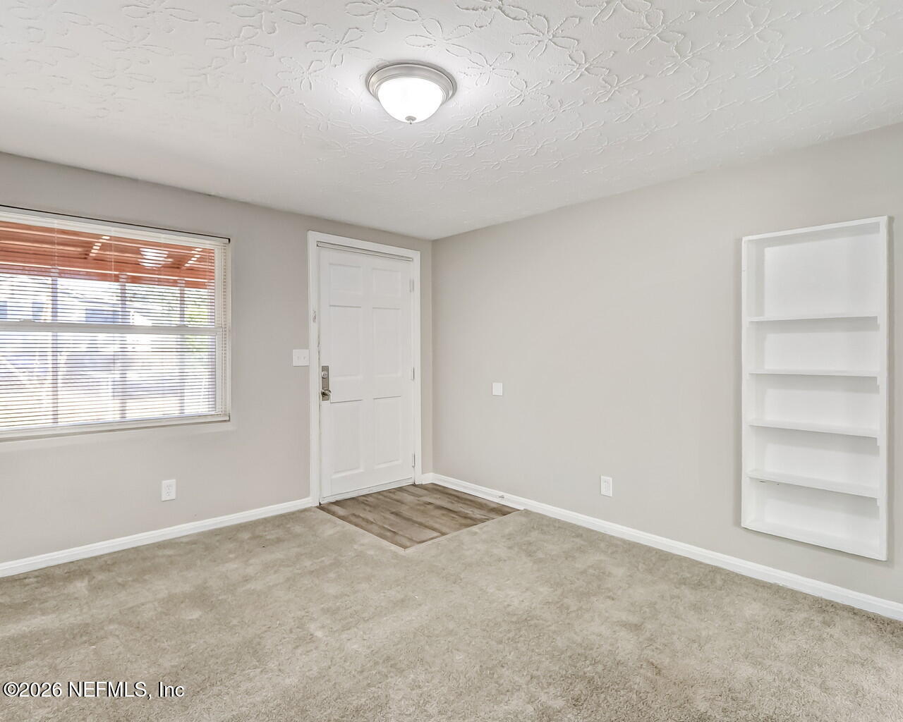 2140 Jayson Avenue Jacksonville, FL 32208 - Photo 8 of 34 an empty room with a window