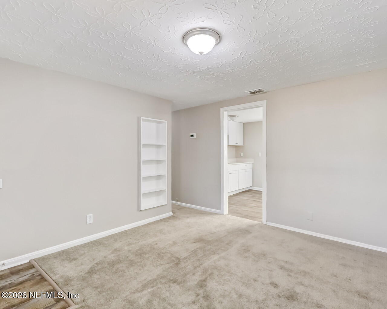 2140 Jayson Avenue Jacksonville, FL 32208 - Photo 9 of 34 a view of an empty room and a window