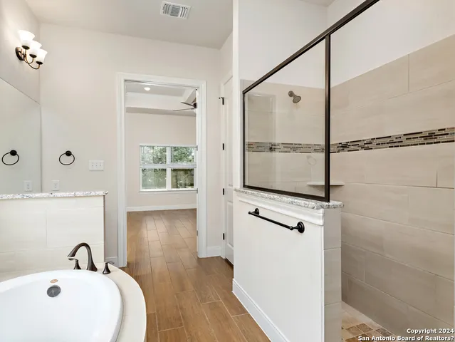 a bathroom with a bathtub and a sink