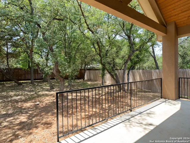 a view of balcony with wooden floor