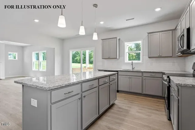 an empty room with windows and ceiling fan