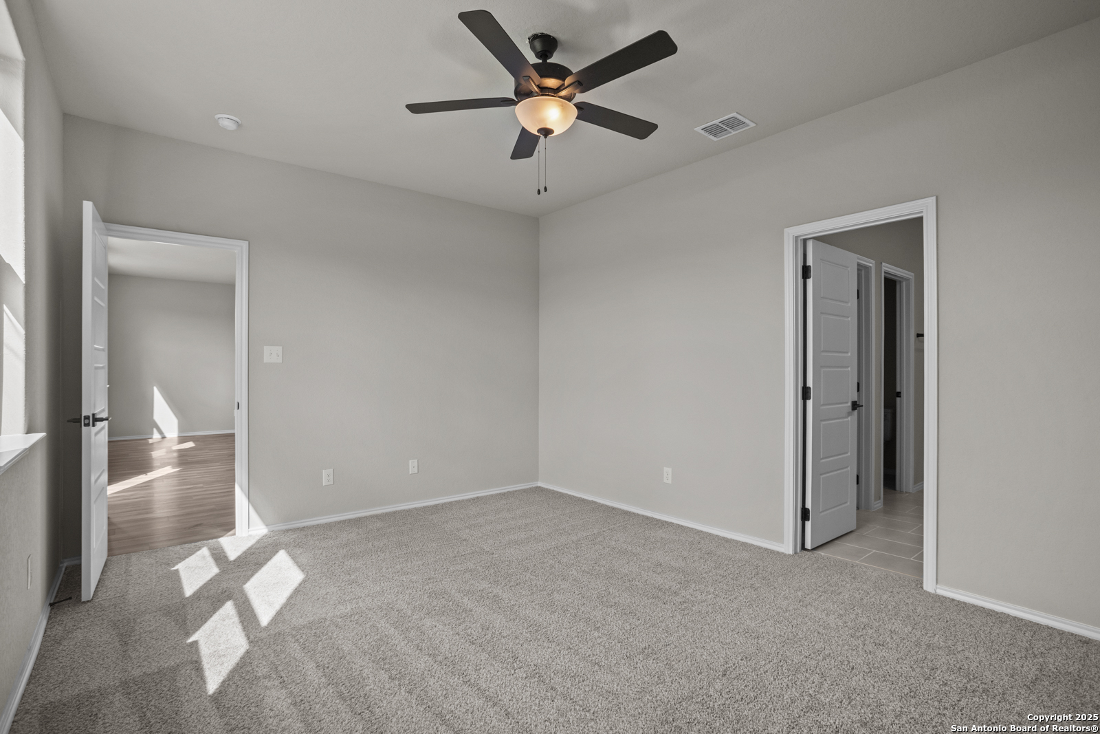6871 Comanche Cave San Antonio, TX 78233 - Photo 20 of 41 a view of an empty room and a ceiling fan