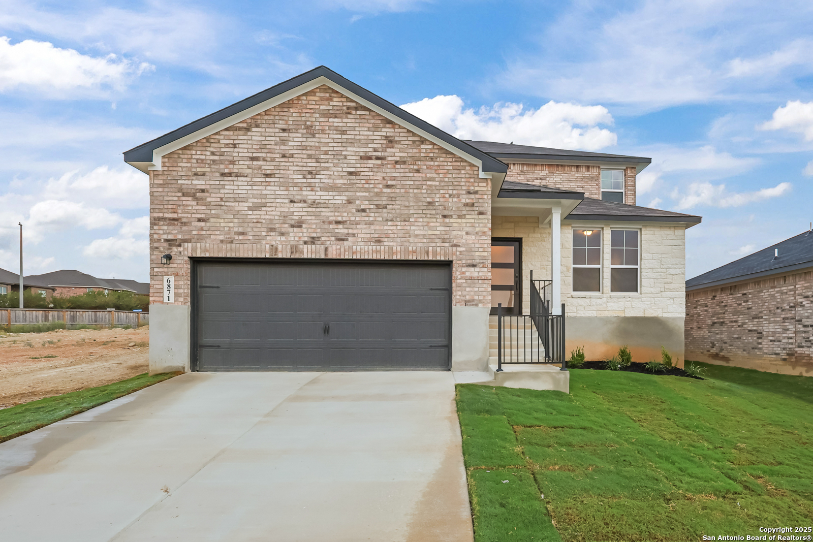 6871 Comanche Cave San Antonio, TX 78233 - Photo 2 of 41 a view of a house with a garden and yard