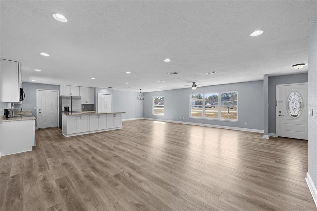606 Bama Road Brandon, FL 33511 - Photo 14 of 44 a view of kitchen with furniture and wooden floor