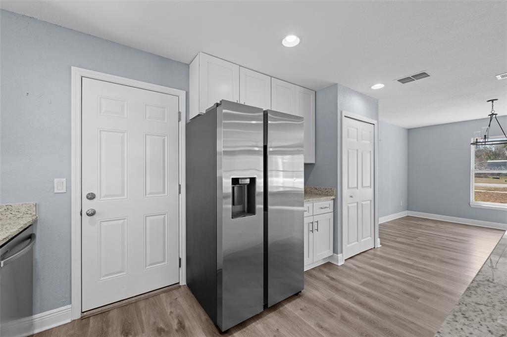 606 Bama Road Brandon, FL 33511 - Photo 18 of 44 a kitchen with stainless steel appliances a refrigerator and a sink