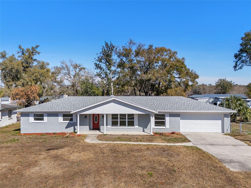 606 Bama Road Brandon, FL 33511 - Photo 2 of 44 a front view of a house with a yard