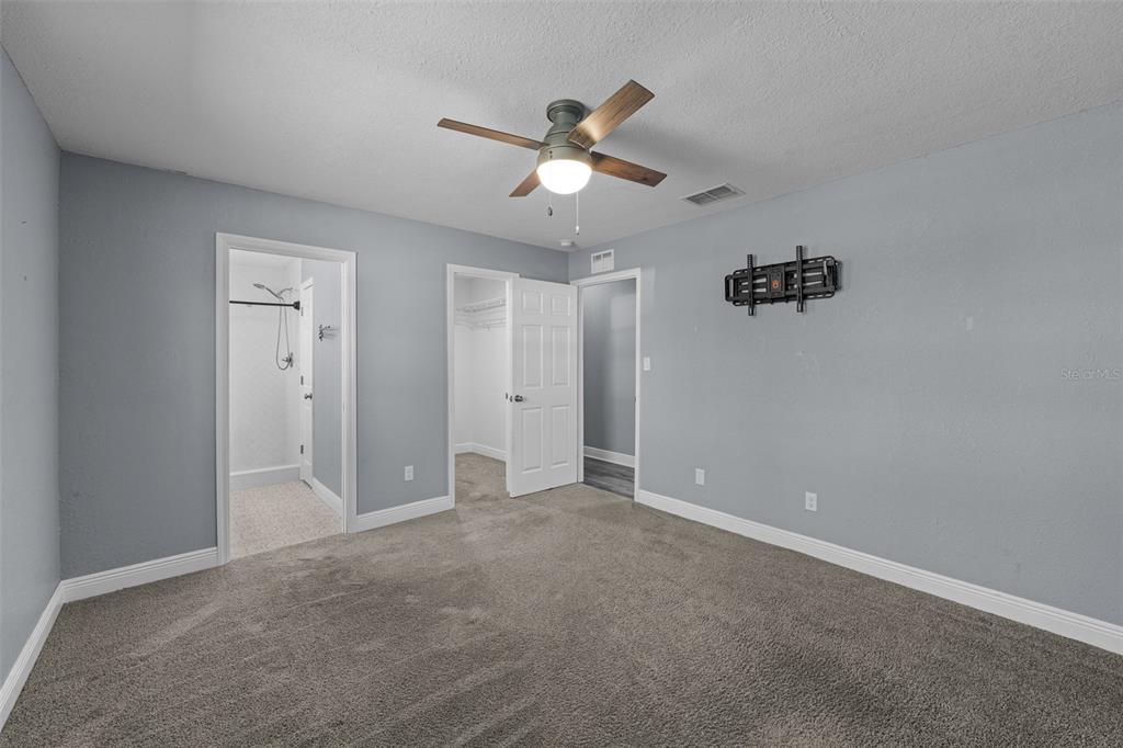 606 Bama Road Brandon, FL 33511 - Photo 21 of 44 a view of an empty room and a ceiling fan