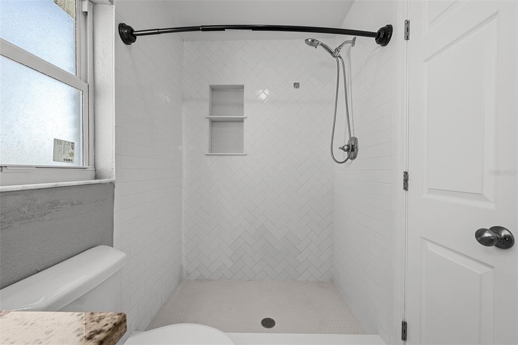 606 Bama Road Brandon, FL 33511 - Photo 25 of 44 a bathroom with a shower and toilet