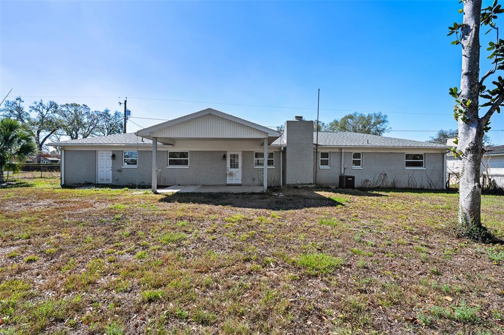 606 Bama Road Brandon, FL 33511 - Photo 39 of 44 a front view of a house with a garden