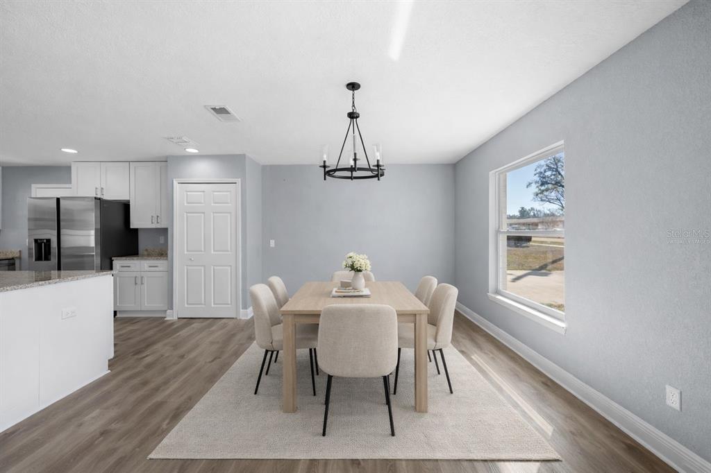 606 Bama Road Brandon, FL 33511 - Photo 8 of 44 a view of a dining room with furniture window and wooden floor