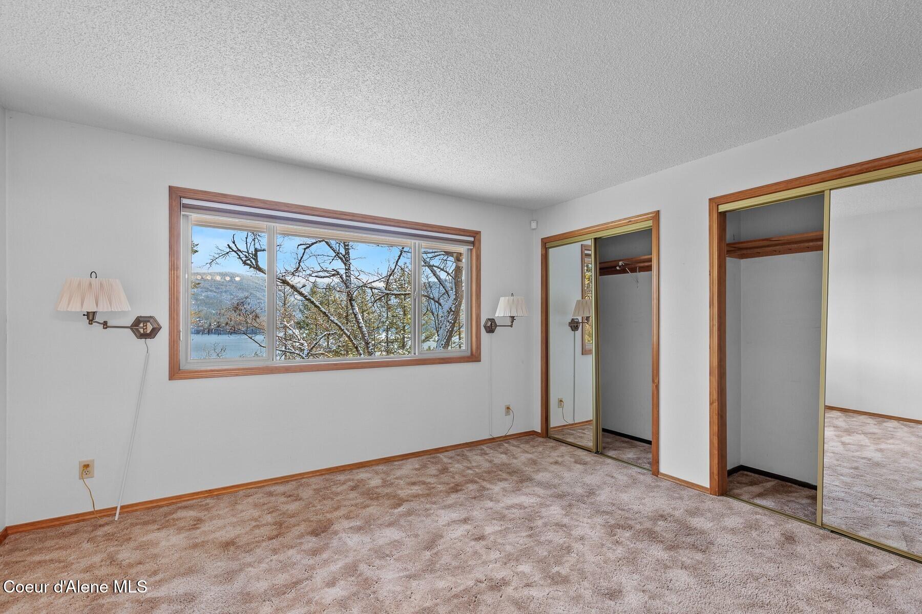 5977 East McMahon Road Hayden, ID 83835 - Photo 17 of 39 Main Flr Bedroom with Lake Views