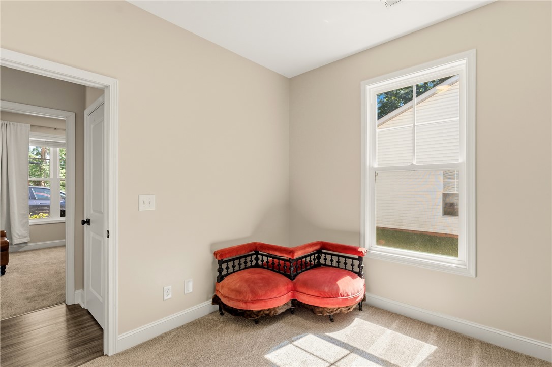 47 A Main Street Pelzer, SC 29669 - Photo 23 of 27 Bright, inviting room with plush carpeting and a large window.