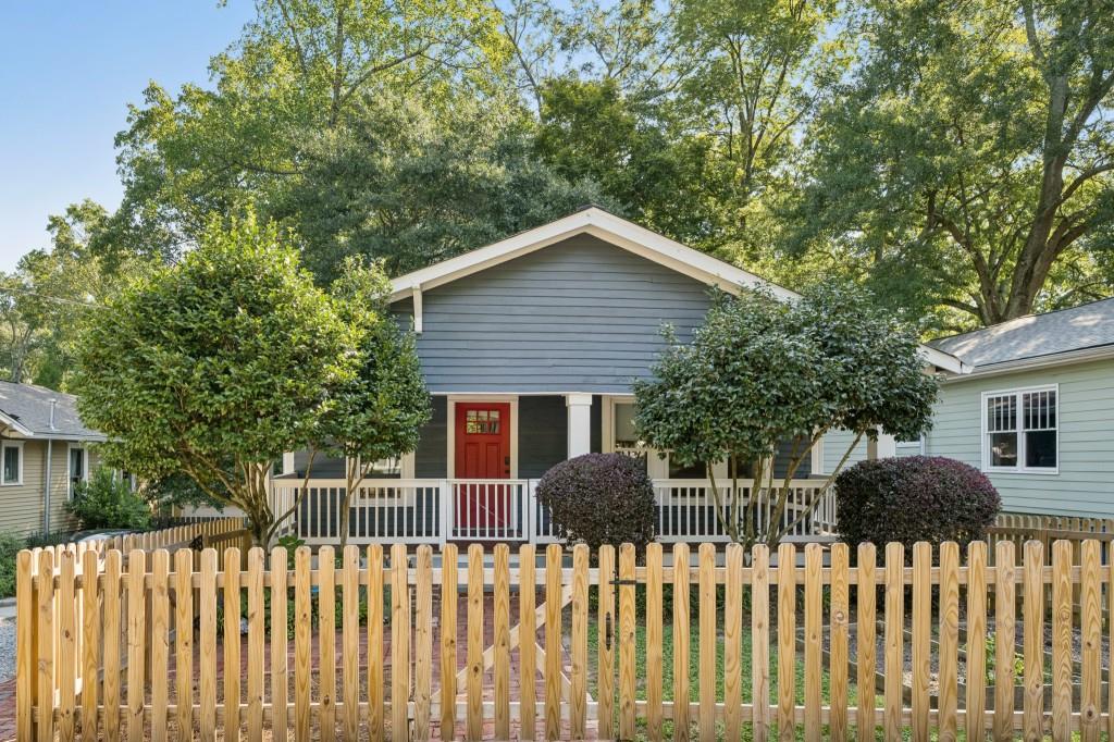 85 Rocky Ford Road Northeast Atlanta, GA 30317 - Photo 1 of 1 a front view of a house with a garden