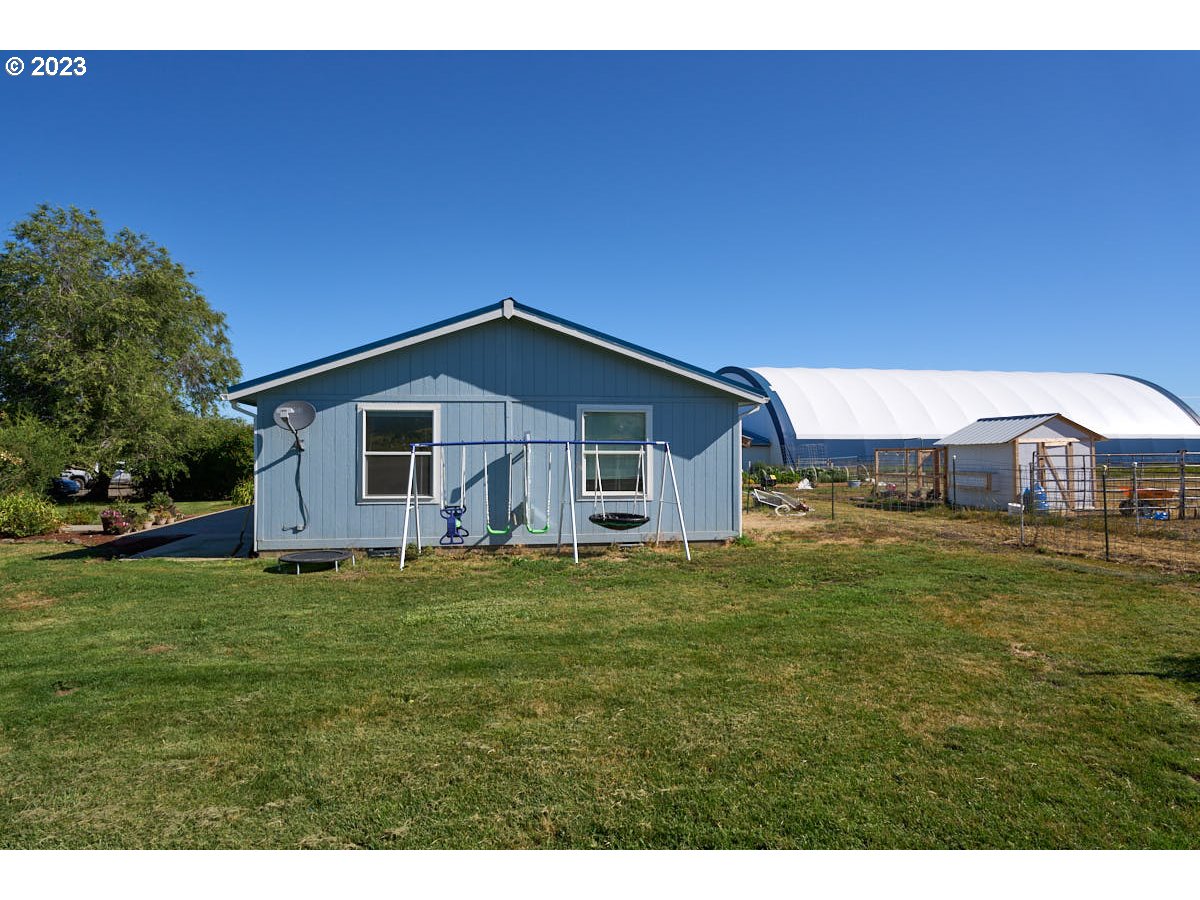 81481 Valley View Road Joseph, OR 97846 - Photo 8 of 24 a big house with a big yard and large trees