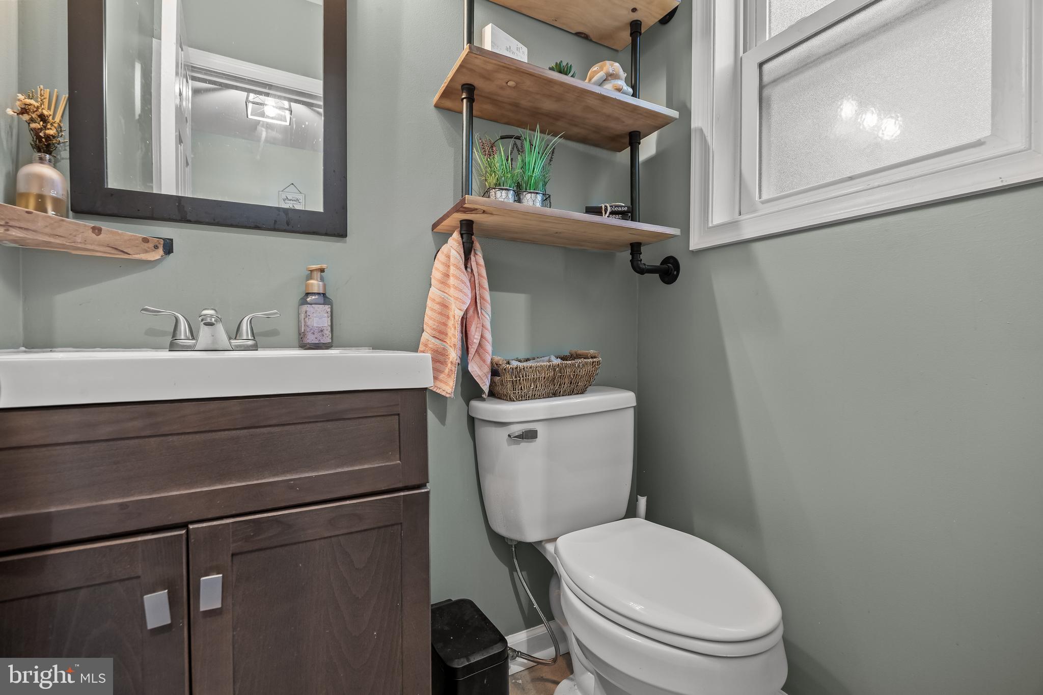 235 Waterford-Blue Anchor Road Hammonton, NJ 08037 - Photo 17 of 29 a bathroom with a toilet sink and mirror