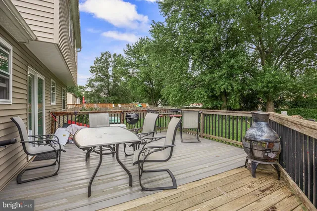 a view of a chairs and table on the deck