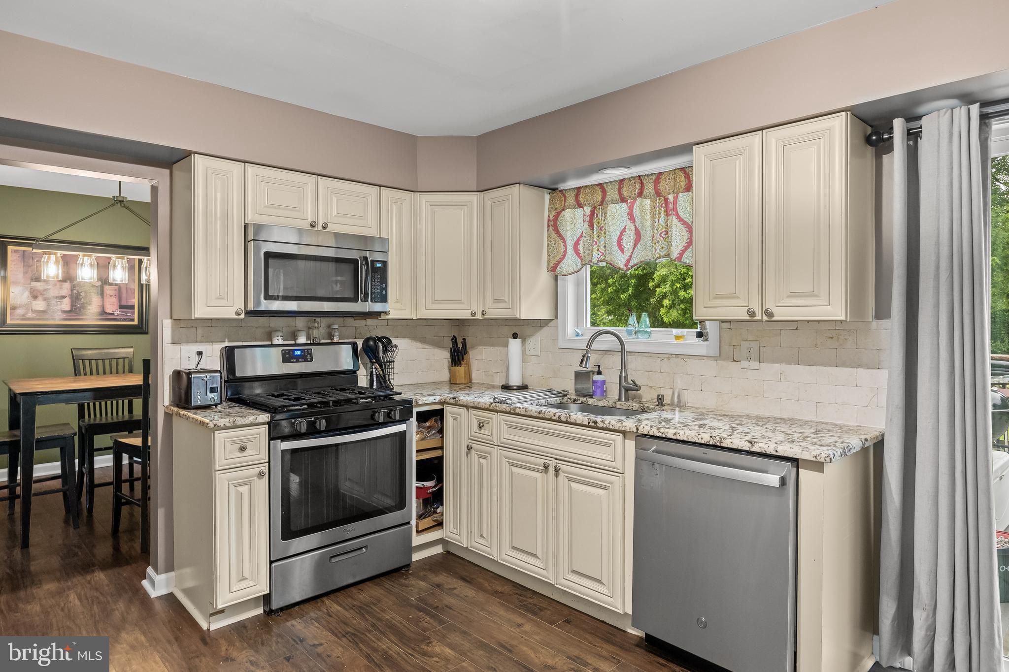 235 Waterford-Blue Anchor Road Hammonton, NJ 08037 - Photo 9 of 29 a kitchen with white cabinets appliances and a window