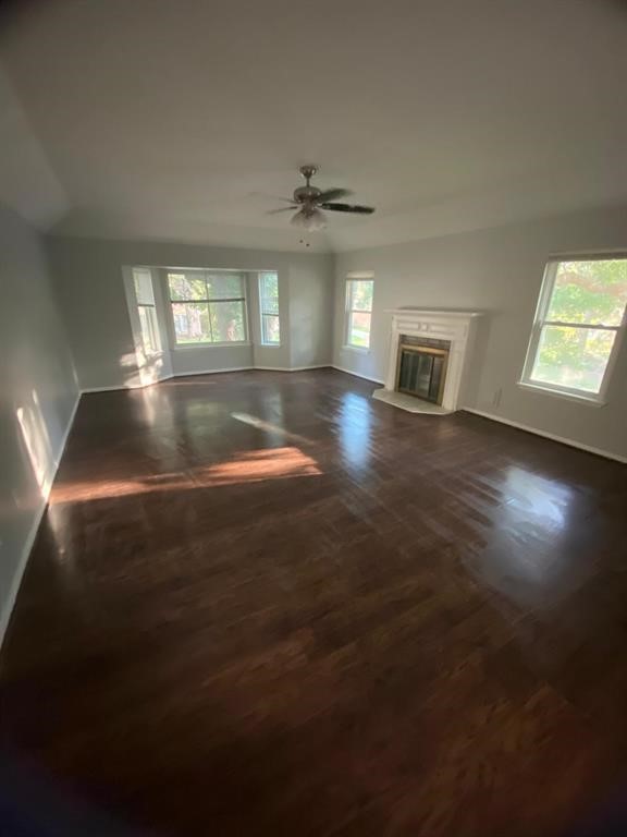 5710 Glenmere Lane Spring, TX 77379 - Photo 3 of 9 wooden floor in an empty room with a window