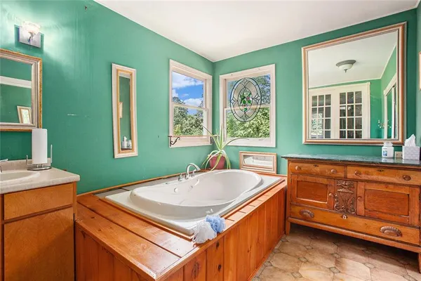 a kitchen with stainless steel appliances granite countertop a sink and a stove top oven