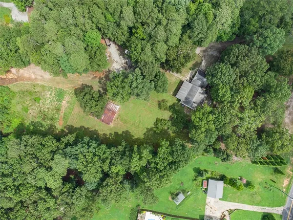 a aerial view of a house with a yard