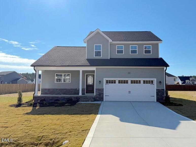 244 Godwin Gate Street, Unit 56 Linden, NC 28356 - Photo 2 of 21 a view of a house with a yard