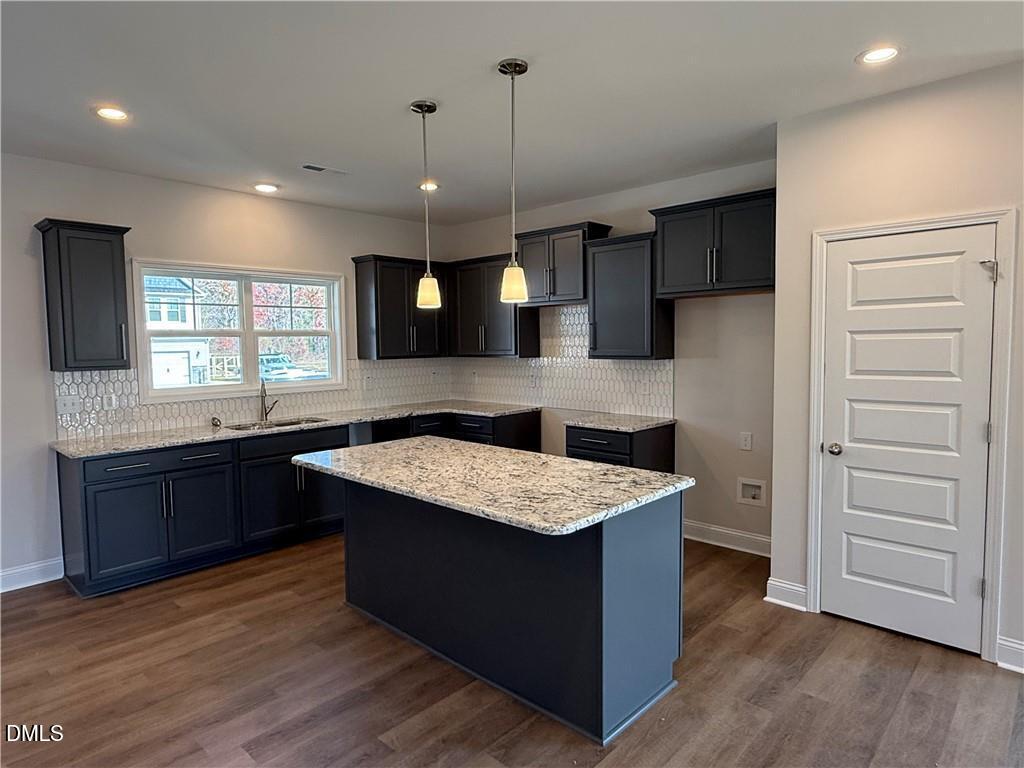 244 Godwin Gate Street, Unit 56 Linden, NC 28356 - Photo 5 of 21 a kitchen with a stove a sink and a refrigerator
