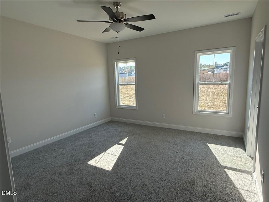 244 Godwin Gate Street, Unit 56 Linden, NC 28356 - Photo 9 of 21 a view of an empty room with a window