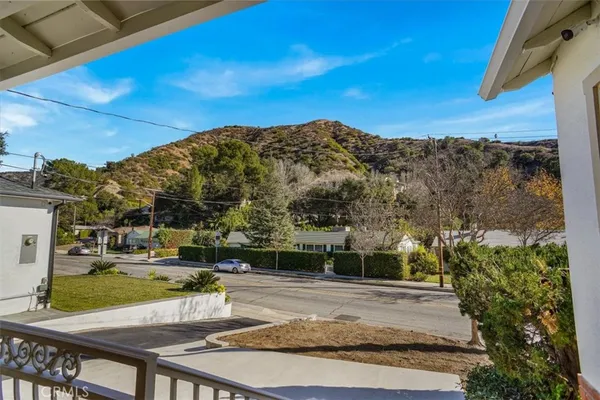 a view of a backyard with sitting area