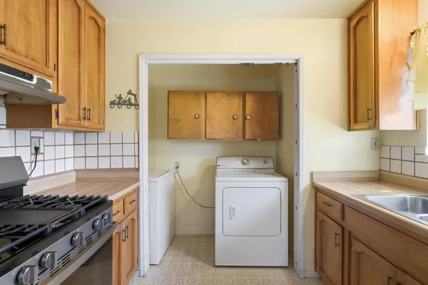 a kitchen that has a sink and a stove