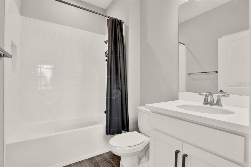 13729 Rangeland Boulevard Odessa, FL 33556 - Photo 11 of 30 a bathroom with a sink toilet and shower