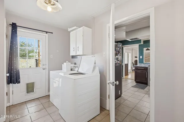 a view of a hallway to kitchen and dining room