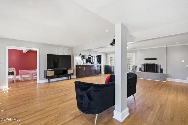 a living room with furniture and a flat screen tv