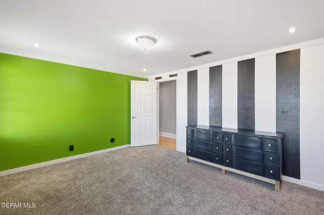 a view of room with window and cabinet