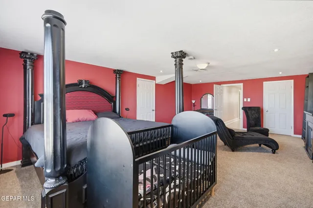 a bedroom with furniture and a window